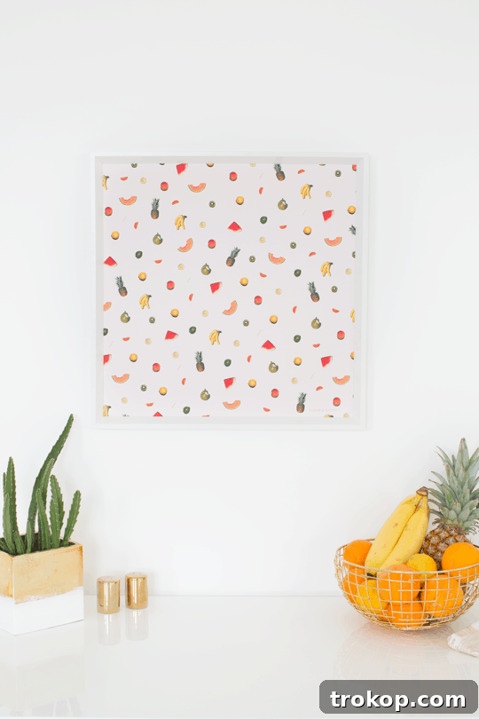 Completed DIY printable fruit wall art hanging in a cozy home setting.