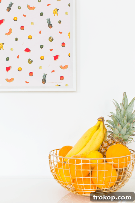 Styled room featuring DIY printable fruit wall art prominently displayed.