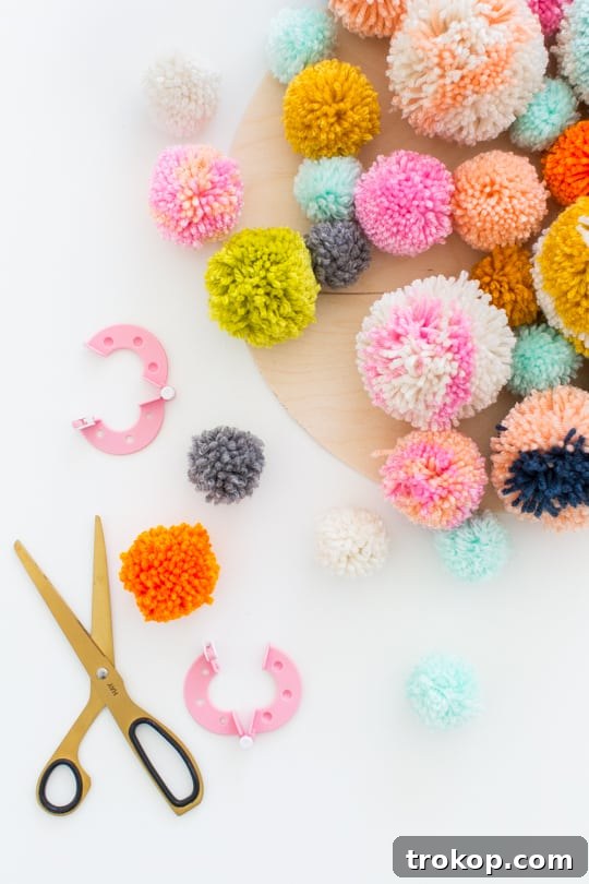 Handmade Pom Pom Wall Art 6 Step 2 -DIY Pom Pom Wall Hanging by Top Lifestyle Blogger Ashley Rose | Sugar & Cloth #DIY #pompom #wallhanging #yarn #yarnpompoms #homedecor #diydecor #colorful #make