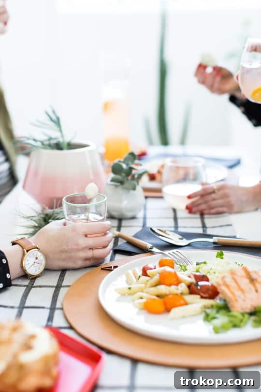 Grapefruit Lemonade Cocktail with DIY bunny tail stirrer and elegant table setting