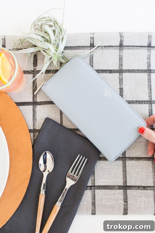 Modern Easter table setting with DIY leather chargers and dark linens