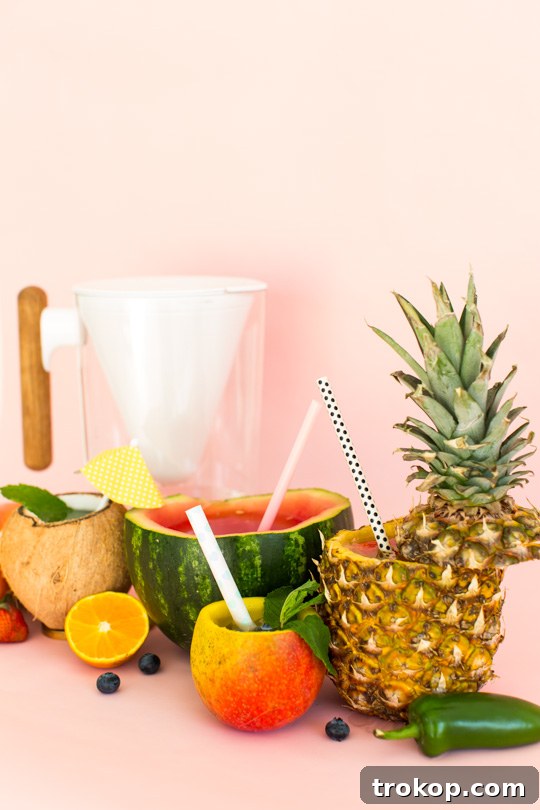 5 Refreshing Infused Water Recipes & DIY Fruit Cups 12 Close-up of a glass of infused water with fresh berries and citrus slices