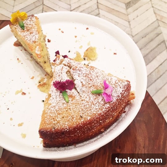 Delicious olive oil cake garnished with edible flowers