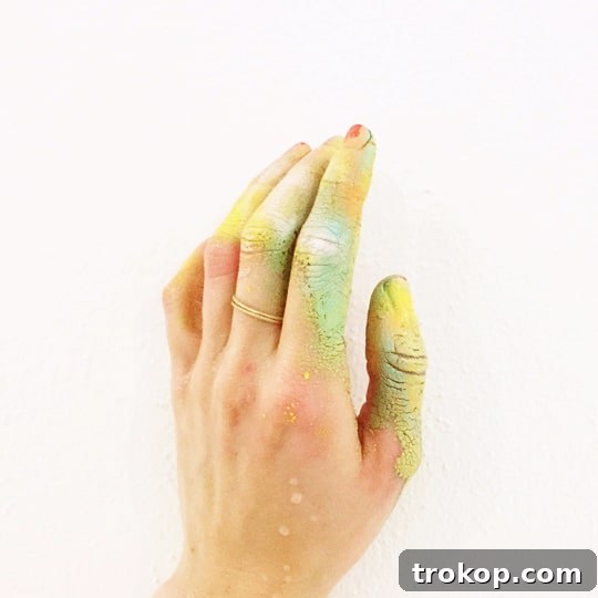 Colorful hands after a late-night spray painting session