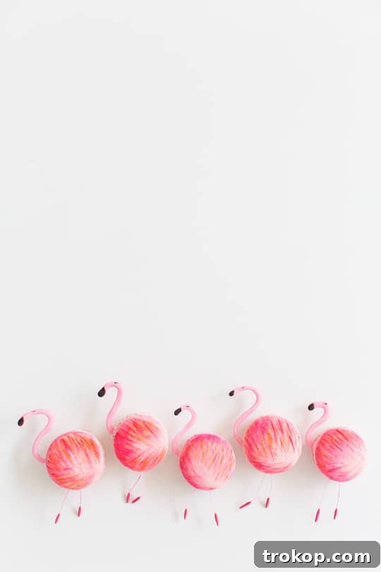 Close-up of a DIY flamingo macaron, highlighting the painted details and chocolate head