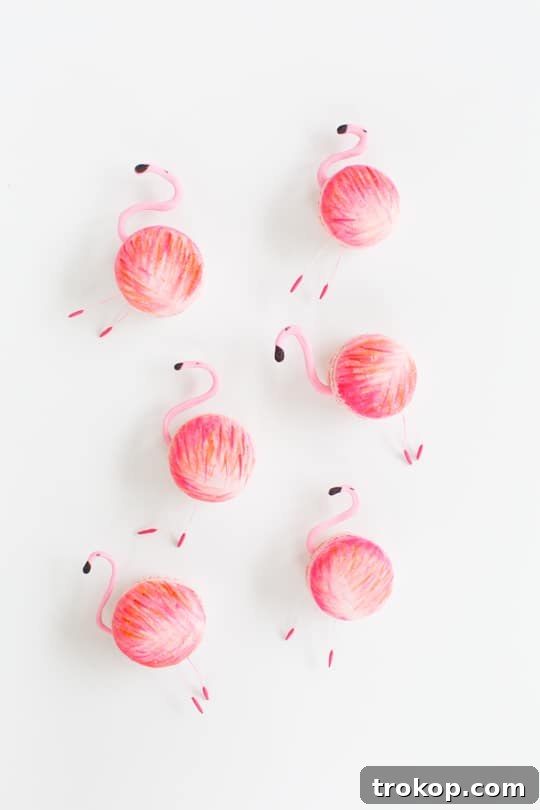 A row of adorable flamingo macarons, standing tall and ready for display