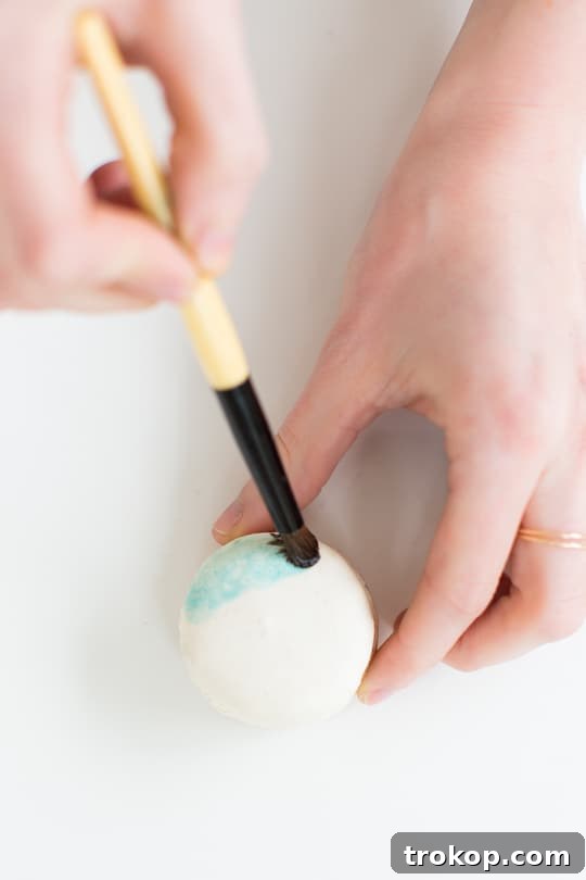 Mixing gel food coloring with almond extract for edible paint