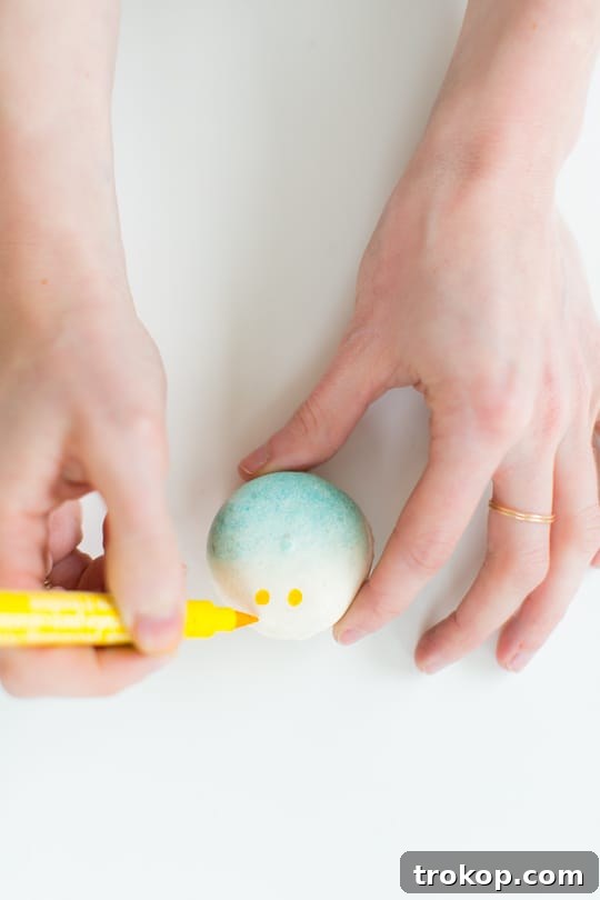Painting the ocean waves on DIY beach macarons