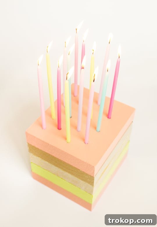Another view of the DIY wooden birthday cake decor on a table