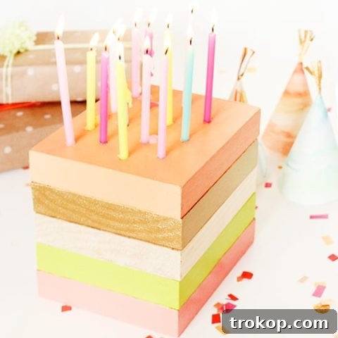 DIY wooden birthday cake centerpiece with mini taper candles