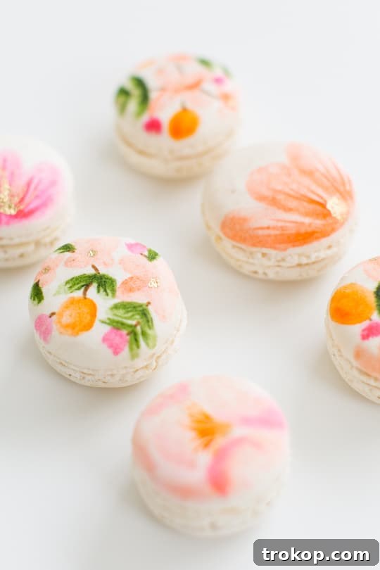 Blossom Bites: Crafting Hand-Painted Floral Macarons 9 A close-up view of intricately painted floral macarons on a dessert platter.