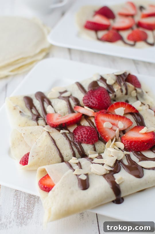 Strawberry Almond Crepes with Decadent Chocolate Drizzle 4 Step-by-step instructions for making strawberry almond crepes with chocolate sauce