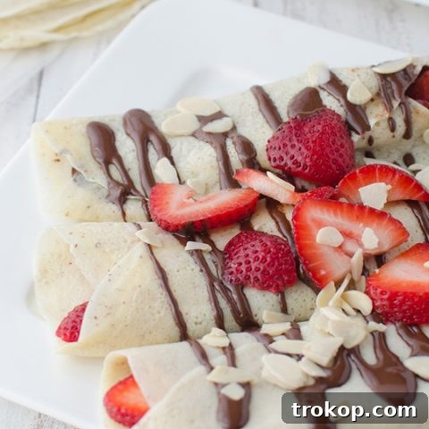 Strawberry Almond Crepes with Decadent Chocolate Drizzle 7 Strawberry Almond Crepes with Chocolate Sauce