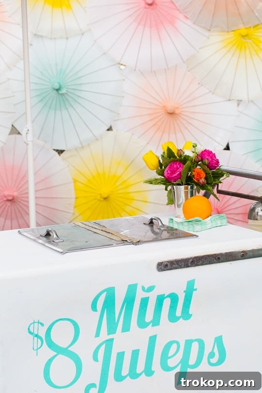 Stylishly Adorned Mint Julep Cart with Vibrant Floral Arrangements