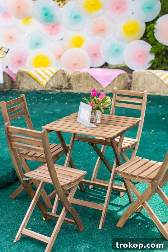 Guests Relaxing on Patio Furniture under Stylish Striped Umbrellas at an Event