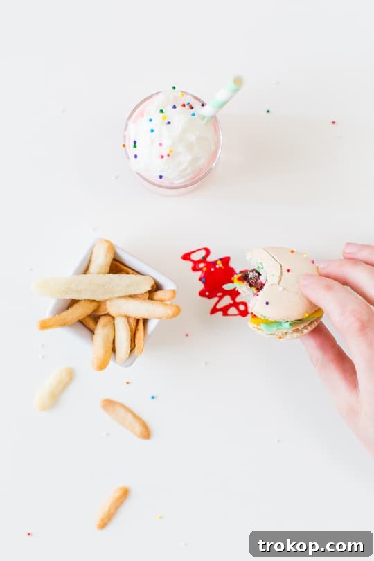 A refreshing mini strawberry milkshake, perfectly complementing the sweet and savory miniature dessert spread.