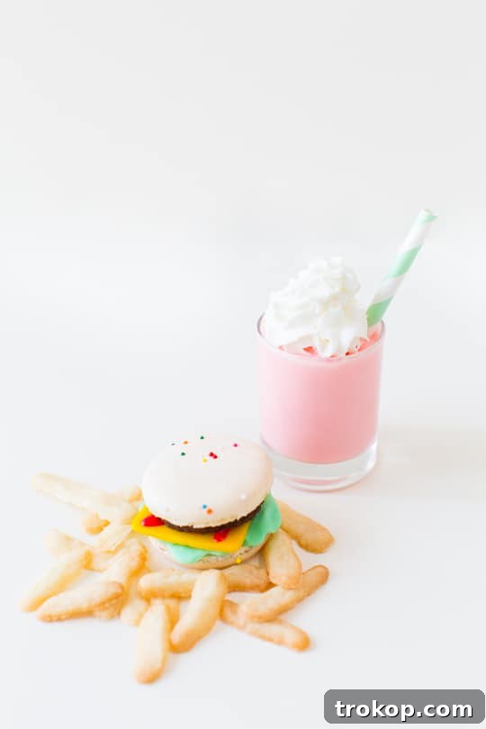 The finished mini macaron cheeseburger, showcasing its delightful layers and vibrant colors, ready to be served.