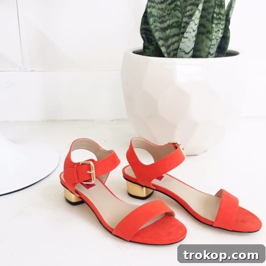 Uncut & Unfiltered: Backstage 6.1 3 Close-up shot of elegant gold heeled sandals with a minimalist design