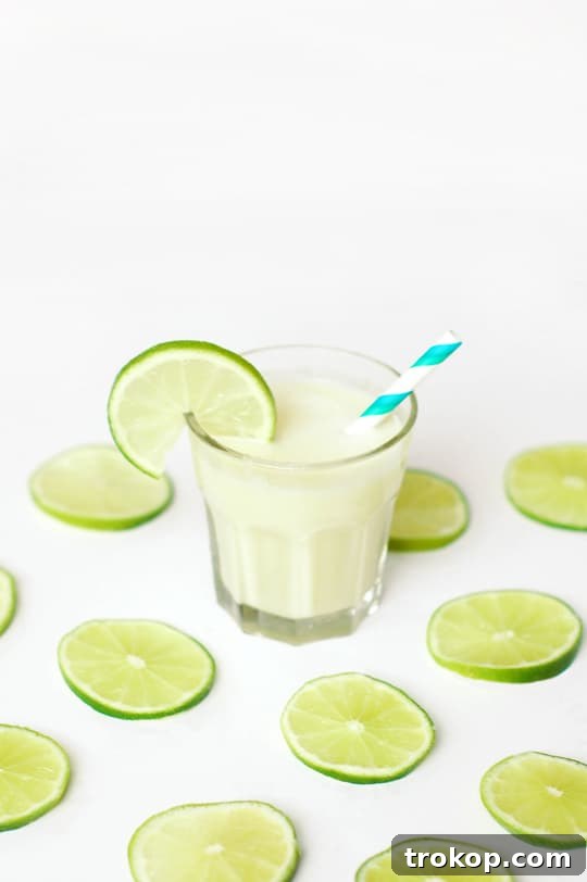 Glasses of Spiked Brazilian Limeade - A collection of refreshing cocktails served in various glasses, perfect for summer.