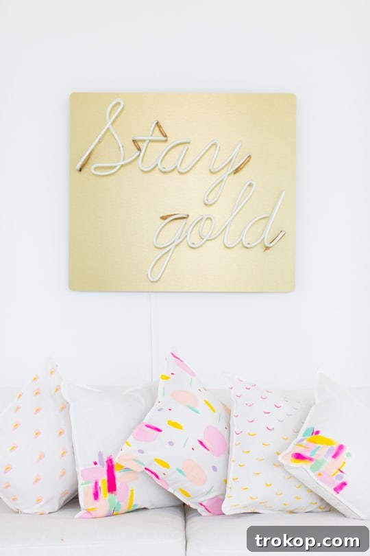 Vibrant abstract pattern throw pillows on a white couch