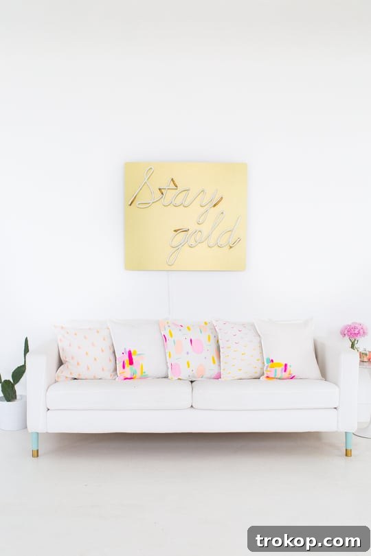 Stylish collection of handmade throw pillows on a white upholstered bench