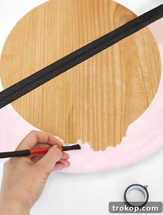 Stylish DIY Color Block Hanging Mirror 5 First coat of paint applied to the DIY hanging mirror