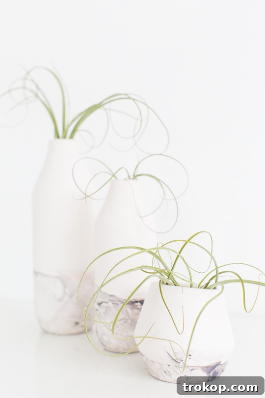 A collection of beautifully marble-dipped vases, adding a touch of elegance to a home setting.