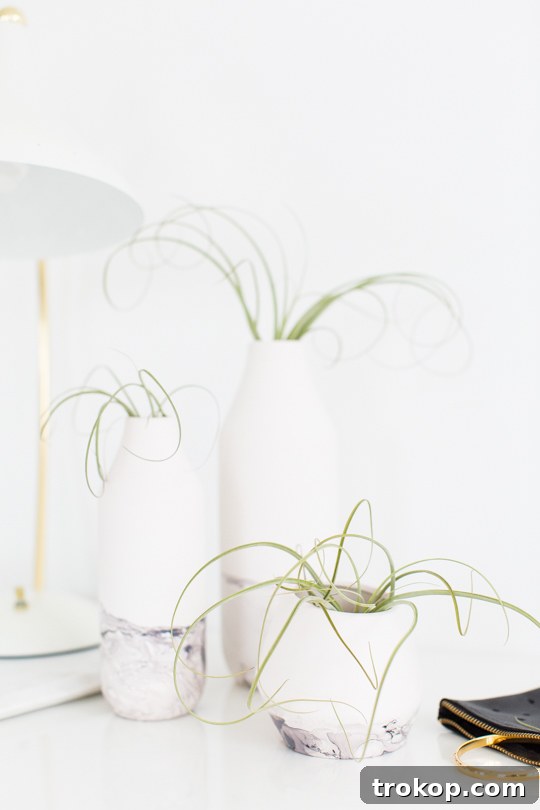 A beautifully marble-dipped ceramic vessel, adorned with flowers, standing as a centerpiece.
