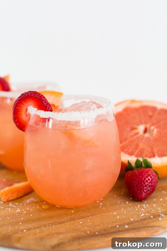 Recipe card for the Strawberry Grapefruit Salty Dog cocktail, detailing ingredients and instructions.