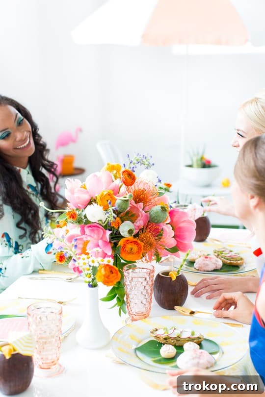 Guests in stylish 60s inspired outfits pose at a Retro Summer Brunch, highlighting vintage fashion and a lively party atmosphere.