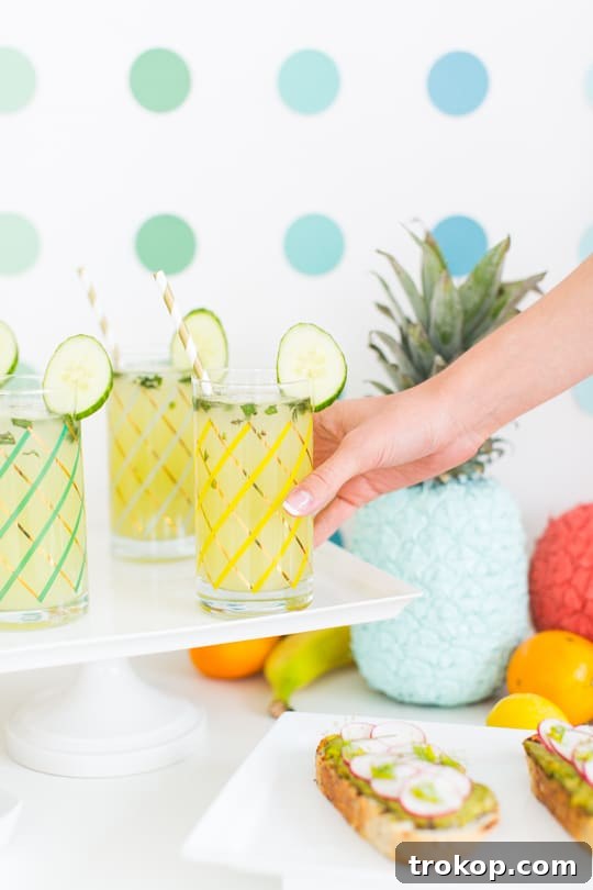 DIY striped drink umbrellas crafted for a Retro Summer Brunch, adding a vintage and festive touch to cocktails and beverages.