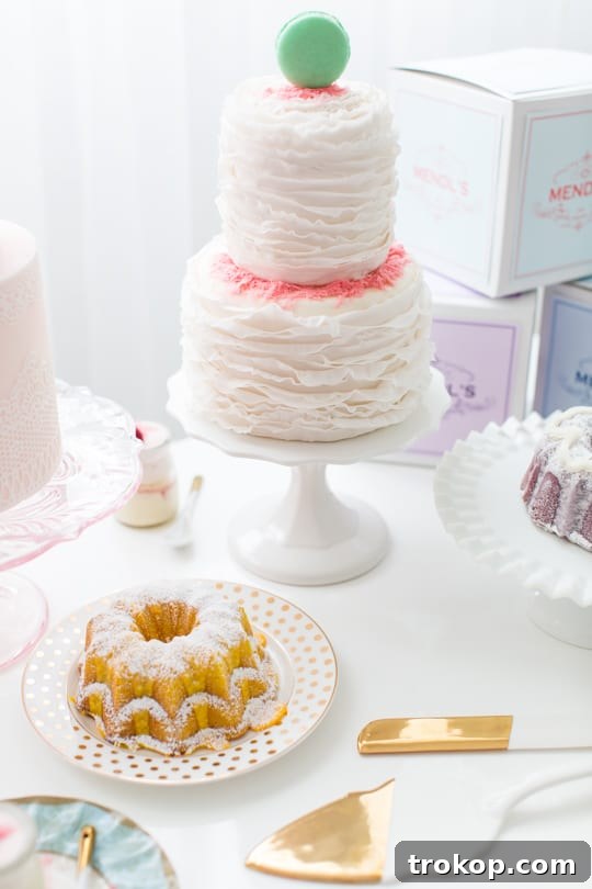 Assortment of Mendl's boxes in various pastel colors on a table