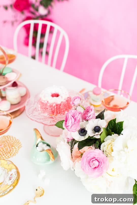 Models in BHLDN dresses holding Mendl's boxes at a tea party