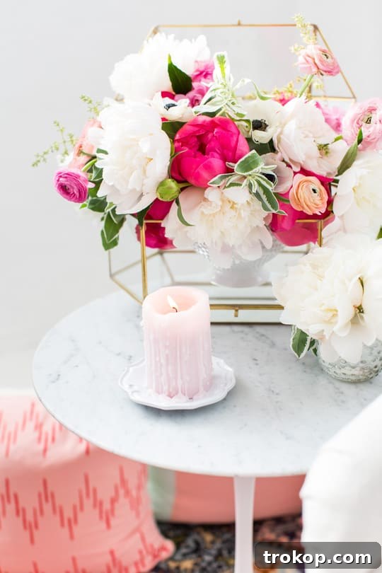 DIY ombre floral backdrop with pink flowers and a bed sheet