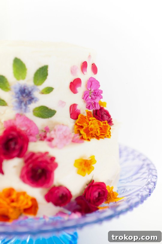 Close-up of edible flowers arranged on a cake