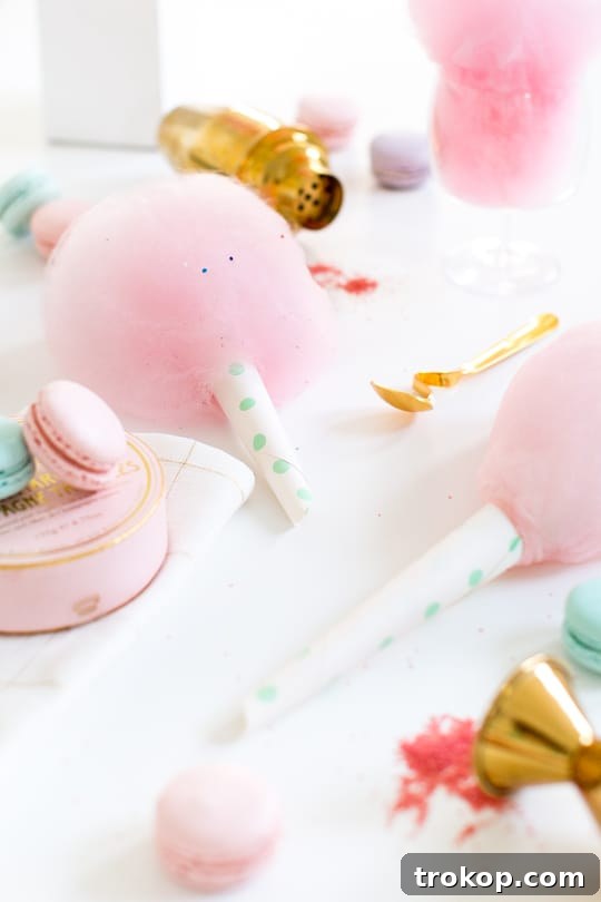 Spiked cotton candy sugar drying on a sheet pan