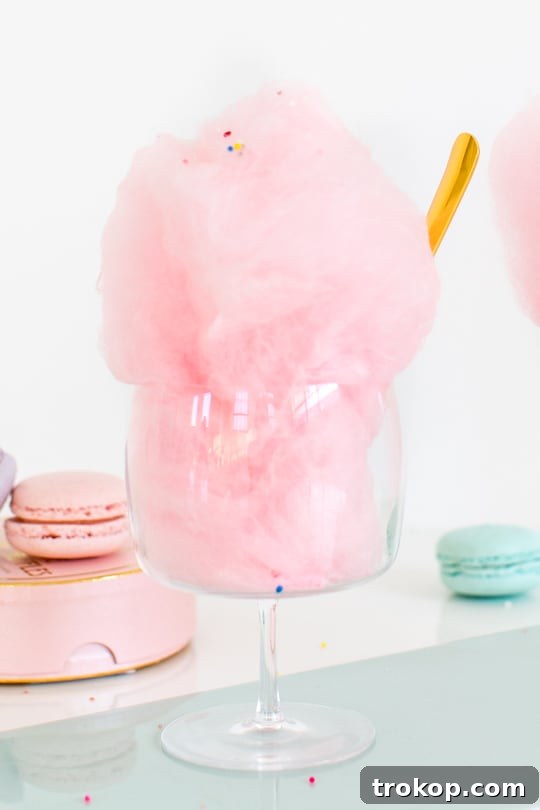 Mixing floss sugar and vodka in a bowl for spiked cotton candy