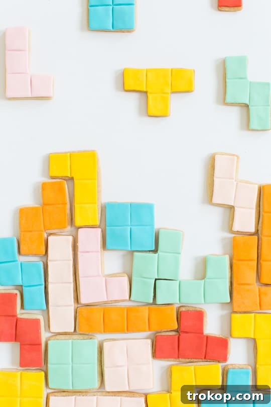 Pixel Perfect Tetris Bites 3 Close-up of baked Tetris cookies cooling on a wire rack, ready for decoration