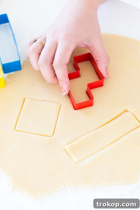 Pixel Perfect Tetris Bites 6 Close-up of cookie dough being rolled out with a rolling pin with measuring bands