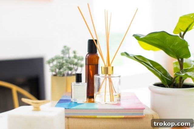 Handcrafted Home Fragrance 7 A horizontal shot of a stylish reed diffuser with vibrant essential oil bottles arranged beside it, curated by a top lifestyle blogger.