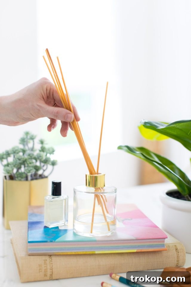 Handcrafted Home Fragrance 10 A comprehensive photo illustrating the steps to make a reed diffuser, highlighting its simplicity and natural elegance.