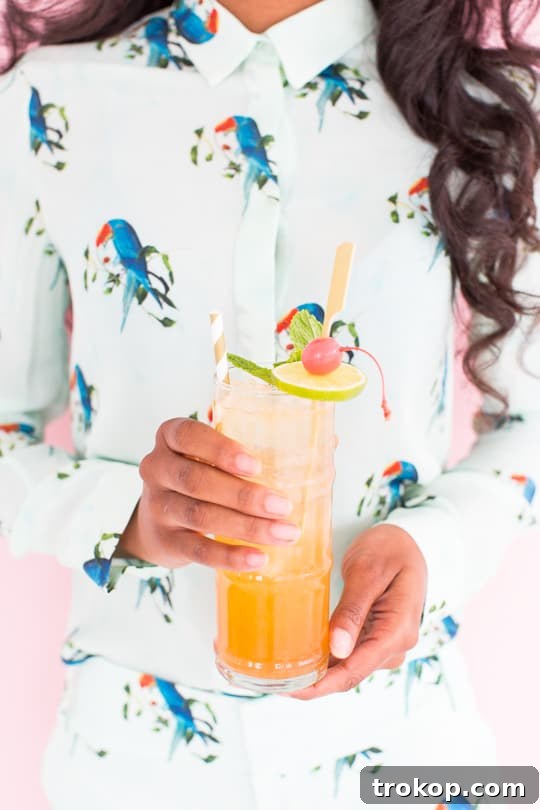 Close-up of the elegant Esmeralda Fizz cocktail showing its golden hue and subtle bubbles.