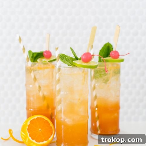 Esmeralda Fizz Cocktail with orange slice and mint garnish