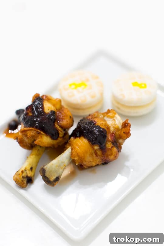 The Ultimate Sweet and Savory Dinner Party Guide 13 Close-up of innovative chicken and macaron 'waffles,' highlighting creative culinary presentation