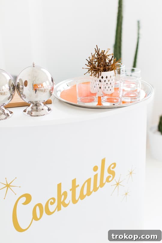 The Ultimate Sweet and Savory Dinner Party Guide 6 Stylish bar setup with vibrant Cointreau cocktails and custom starburst stirrers, ready for guests