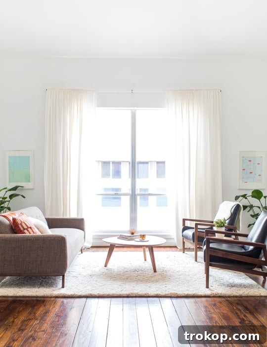 Apartment Living Room Reimagined 5 After shot of the refreshed living room, featuring Arhaus sofa and chairs with a neutral palette