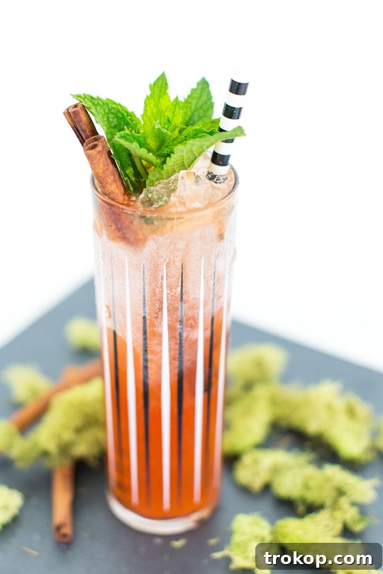 Zombie cocktail ingredients laid out for preparation, featuring various rums, juices, and garnishes.