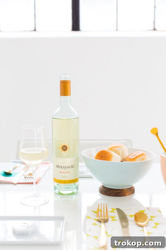 A DIY Footed Serving Bowl placed next to a bottle of wine, hinting at delightful entertaining possibilities.