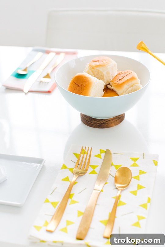 A close-up of a DIY Footed Serving Bowl filled with fresh grapes, highlighting its simple yet sophisticated design.