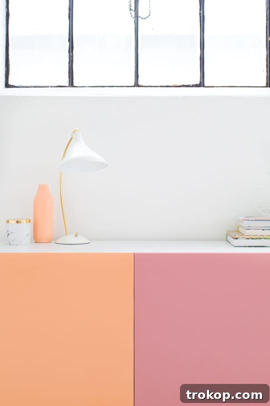 Rows of freshly spray-painted IKEA Besta doors drying, showcasing the bright and diverse color palette.
